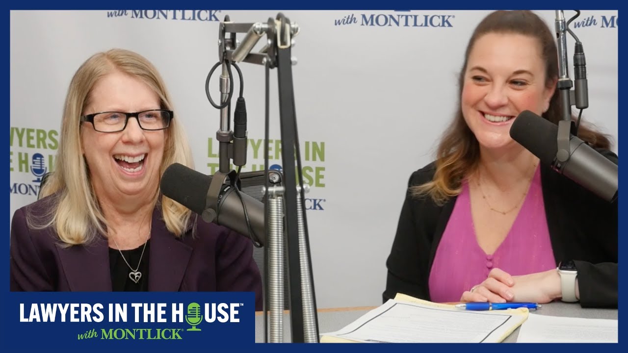 Alt text: Two smiling lawyers in front of Lawyers In The House with Montlick radio show microphones
